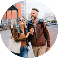 Couple walks down the street discussing money market interest rates.