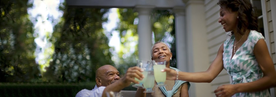 Family celebrating after getting a great HELOC rates with a toast.